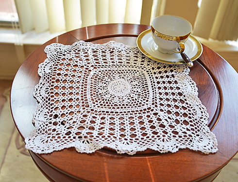 Square crochet placemat. 13" square. white color. 1 piece